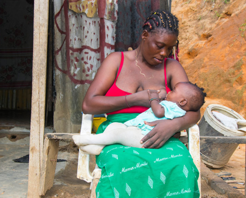 Congolese mother breastfeeding her baby