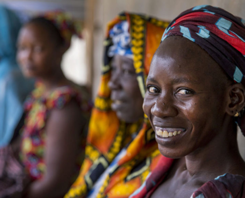 Women wait to receive sexual reproductive health services at a mobile clinic in Senegal