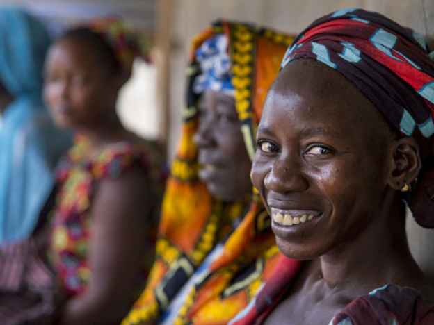 Women wait to receive sexual reproductive health services at a mobile clinic in Senegal