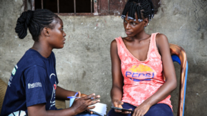 Two seated women in conversation