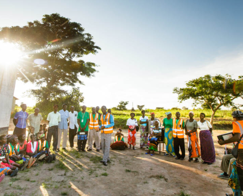A group is engaged by a community leader in Zambia