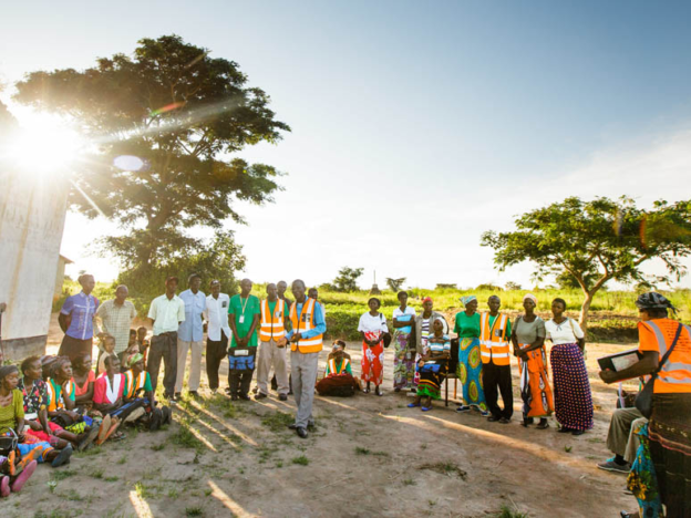 A group is engaged by a community leader in Zambia