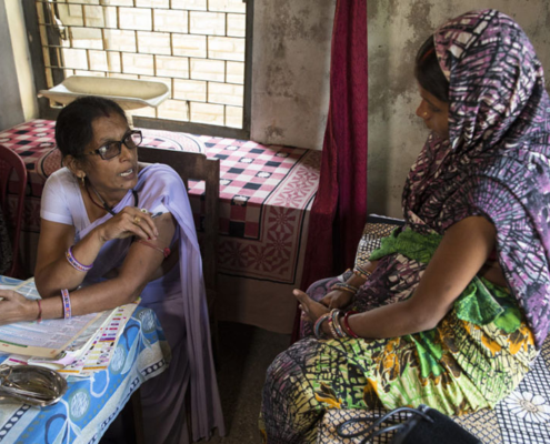 An auxiliary midwife nurse provides medical care to women at a rural health center